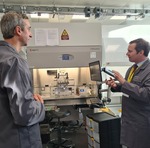 Chris Green MP on the right speaking to Dr Ian Wimpenny on the left in the bioprinting facility. 