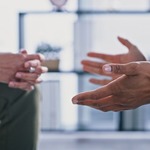 Hands of two people talking